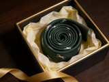 The Ascot Stallion Silk Tie rolled in a gift box, close detail of the silk weave