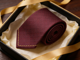 The Belgravia Micro-Diamond Silk Tie rolled in a gift box, close detail of the silk weave