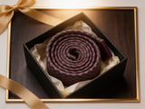 The Knightsbridge Basketweave Tie rolled in a gift box, close detail of the silk weave