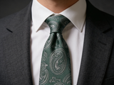 Sovereign Paisley Emerald Tie worn in a four-in-hand knot with a white collar and charcoal suit